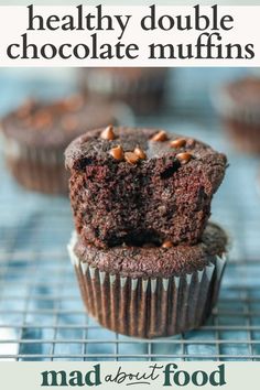 chocolate muffins stacked on top of each other with the words healthy double chocolate muffins above them