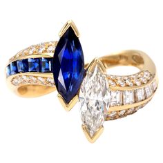 Exquisite "toi et moi" ring showcasing a marquise shape diamond and sapphire, from which a matching line of square diamonds and sapphire goes down on the shank. round brilliant cut diamonds tastefully complement these gemstones. All diamonds are G VS or better and the sapphires have the lovely saturated royal blue colour. The excellent make combined with the high quality of the stones give this timeless design a real "haute joaillerie" feel Diamond marquise: ± 0,85 carat Sapphire marquise: ± 0,9 1920s Engagement Ring Vintage, 1920s Engagement Ring, Royal Blue Colour, Engagement Rings Romantic, Victorian Engagement Rings, Contemporary Engagement Rings, Marquise Shape Diamond, Antique Diamond Rings, Modern Engagement Rings