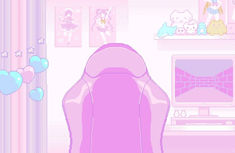 a pink couch sitting in front of a laptop computer