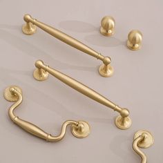 an assortment of brass handles and knobs