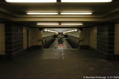 an empty subway station with no people on the platform or in the tunnel, at night