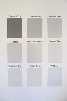 several shades of gray paint on a white wall with the names of different colors and sizes