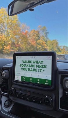 a car dashboard with a sign on it that says the secret to keeping kids safe is coming you already do't