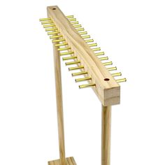 a wooden musical instrument stand with gold strings