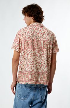 Elevate your summer style with the Red Paisley Camp Shirt from PacSun. Featuring a classic collared neckline and short sleeves, it offers a comfortable regular fit perfect for laid-back days. Complete with button closures and a vibrant paisley print throughout, this shirt adds a touch of retro flair to any outfit.


	Collared neckline
	Short sleeves
	Standard fit
	Button closures
	Paisley print throughout
	Model is wearing size medium Patterned Casual Short Sleeve Shirt Relaxed Fit, Casual Patterned Short Sleeve Shirt, Relaxed Fit, Casual Patterned Relaxed Fit Short Sleeve Shirt, Casual Relaxed Fit Patterned Short Sleeve Shirt, Casual Patterned Short Sleeve Shirt For Summer, Casual Floral Print Top With Collared Neckline, Casual Cotton Hawaiian Shirt With Johnny Collar, Summer Collared Short Sleeve Shirt With All Over Print, Casual Patterned Camp Shirt With Relaxed Fit