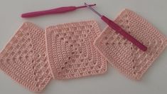 three crocheted squares with a pink handle