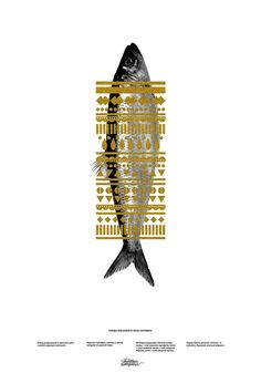 a fish that is sitting on top of a white surface with gold and black designs