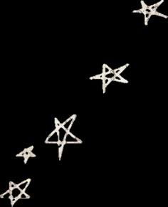 five silver stars are flying in the air together, with one star falling off it's side