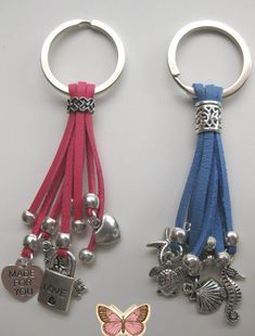 two key chains with charms attached to them