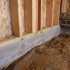 the inside of a house being built with wood and plywood boards on the wall