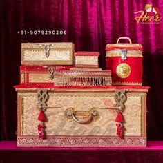 an elaborately decorated chest is displayed on a purple tablecloth with red velvet drapes