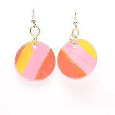 Introducing our vibrant and trendy Yellow and Pink Stripe Paper Circle Earrings! These statement earrings are designed to elevate any outfit with their bold colors and unique circular shape. Handcrafted with care, each earring features a playful combination of yellow and pink stripes, adding a touch of fun and charm to your style. Made from upcycled paper, they are lightweight and comfortable to wear all day long. Whether you're attending a special event or looking to add a pop of color to your Yellow Funky Handmade Earrings, Funky Yellow Handmade Earrings, Funky Handmade Yellow Earrings, Handmade Funky Yellow Earrings, Yellow Funky Earrings For Gift, Multicolor Circular Summer Earrings, Trendy Multicolor Round Earrings, Bold Yellow Drop Earrings, Colorful Playful Summer Earrings