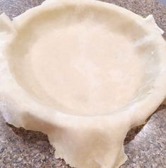 a pie crust is sitting on the counter