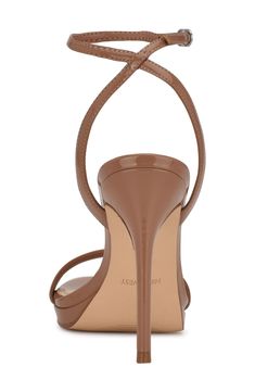 Make a striking statement in this open-toe ankle-strap sandal lifted with a subtle platform and sky-high stiletto heel. 4 1/4" heel; 1/2" platform Synthetic and textile upper and lining/synthetic sole Imported Fitted Open Toe Slingback Sandals With Padded Heel, Fitted Platform Open Toe Sandals, Evening Platform Slingback Sandals In Synthetic, Platform Slingback Sandals With Ankle Strap For Evening, Platform Synthetic Sandals, Synthetic Platform Sandals, Fitted Slingback Sandals With 4-inch Heel, Fitted Platform Sandals, Fitted Open Toe Platform Heels