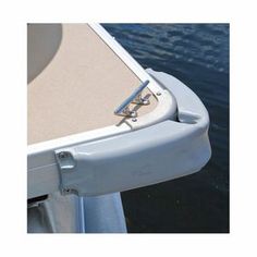 the front end of a boat with an anchor on it's side and water in the background