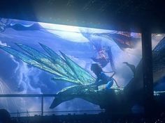 a large screen with an image of a dragon on it