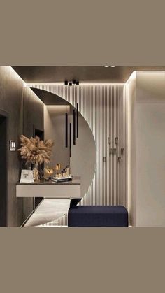 a modern bathroom with an oval mirror and marble countertop, along with a blue bench