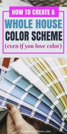 a person holding up some color samples with the text how to create a whole house color scheme even if you love color