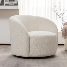 a white chair sitting on top of a carpeted floor