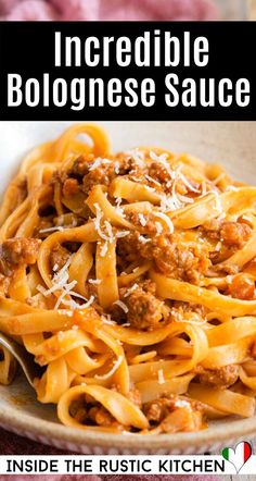 a bowl filled with pasta and sauce on top of a table