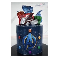 the avengers cake is decorated with fondant and candy