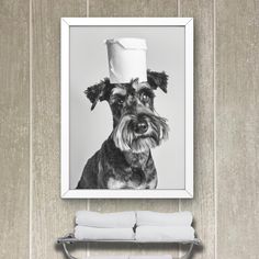 a black and white photo of a dog with a toilet paper roll on its head