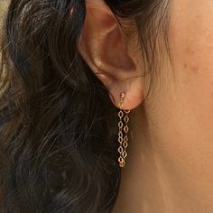 Dazzle up your favorite look with our Sparkle Chain Studs. We love to pair these with our sequin ear cuff for extra shine. Measures approx. 1.25" long14K Gold Filled. Trendy Hypoallergenic Yellow Gold Cartilage Earrings, Hypoallergenic 14k Gold Filled Threader Earrings, Gold Drop Cartilage Earrings For Party, Gold Cartilage Earrings With Adjustable Chain, Gold Hypoallergenic Dangle Cartilage Earrings, Trendy Gold Threader Earrings For Everyday, Adjustable Chain 14k Gold Filled Earrings, Hypoallergenic 14k Gold Ear Cuff, Trendy Gold Dangle Cartilage Earrings