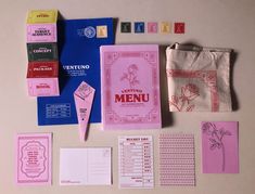 the contents of a menu laid out on top of a table with napkins and other items