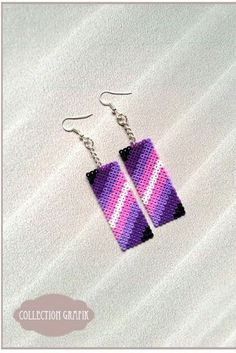 the earrings are made with purple and pink strips