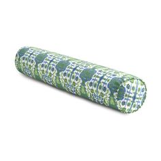 a green, blue and white patterned roll pillow on a white background with the bottom rolled up