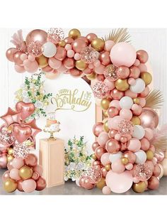 a pink and gold birthday party with balloons, decorations and a sign that says happy birthday