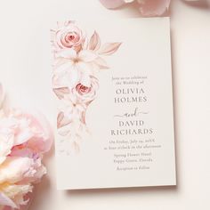 a wedding card with flowers on it next to some peonies and pink carnations