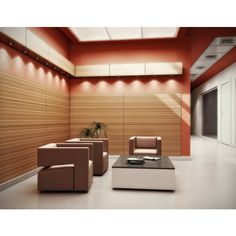 a living room with two couches and a coffee table in front of a wood paneled wall