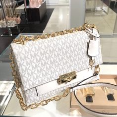 Please look at Approximate dimension below before purchasing. DIMENSIONS: 9.375"W X 5.75"H X 4"D  100% Authentic or Money Back Guarantee~~~ALWAYS!!! MICHAEL KORS CECE MED STUD  SHOULDER BAG CROSSBODY MK LIGHT CREAM MULTI COLOR ITEM DESCRIPTION--- Shoulder bag • Logo-print canvas/faux leather • 89.4% coated canvas/9.6% polyester/1% polyurethane • Trim: 60% polyurethane/20% cotton/20% polyester • Gold-tone hardware • 9.375"W X 5.75"H X 4"D  Strap DROP: 20.75" inches Chain Strap Drop--13.75 inches  • Exterior details: back slip pocket • Interior details: front zip pocket • Lining: 100% polyester • Push-lock fastening White Michael Kors Purse, Michele Kors Bags, Cute Purses For Women, Cute Shoulder Bags, Michael Kors Handbags Crossbody, Bag Logo, Luxury Bags Collection, Handbag Essentials, Mk Handbags