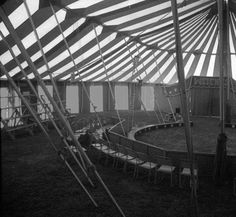 the inside of a large circus tent with chairs