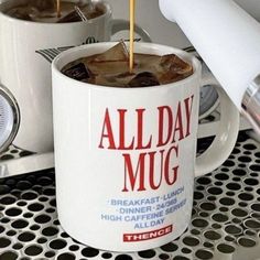 coffee being poured into a mug with the word all day mug on it