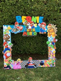 the mario bros frame is sitting in the grass