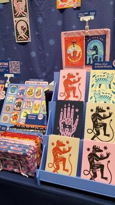 many different colored cards are on display for sale