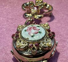 This vintage Pegasus Coro piece is a stunning addition to any jewelry collection. The gold tone locket and brooch feature a beautiful rose pink color and are perfect for holding your favorite photos. The intricate design showcases the Coro brand's attention to detail, and the brooch is a rare find. This piece would make a great gift for any vintage jewelry lover or a special treat for yourself. The brooch is ideal for adding a touch of elegance to any outfit and is sure to become a cherished accessory. FYI: We have been in pastoral ministry for over 40 years, the goal of selling any items on 'powers-gems' is to support children's ministries in Honduras and other nations where children are being taken from living in the city garbage dumps, educated, feed and clothed by Godly people to give Rose Pink Color, Children's Ministry, Pin Jewelry, Jacksonville Fl, 4 Photos, Beautiful Rose, Book Decor, Intricate Design, Showcase Design