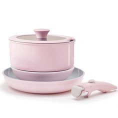 a pink pot and saucer sitting on top of each other