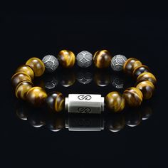 Tiger Eye Premium Bead Bracelet with round 10 millimeter beads combined with a silver logo magnetic clasp. Comes with a premium leather logo box. You will not find the quality of beads I use which are 5A quality rated, the custom silver beads and high quality custom made silver clasp I use for my bracelets at any where close to the value I offer. I use the absolute best stone bead gems there is, my custom made silver beads are solid and I double string my bracelets with a thick gauge stainless s Luxury Beaded Bracelets With Natural Stones, Brown Bracelets With Silver Round Beads, Tiger Eye Gemstone, Falls Church, Bracelet Mens, Tiger Eye Bracelet, Blue Tigers Eye, Tigers Eye Gemstone, Silver Logo