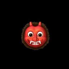 a red mask with horns and teeth on it's face, against a black background