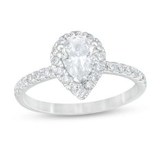 a pear shaped diamond ring with pave set shoulders