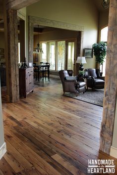 a living room filled with furniture and wooden floors