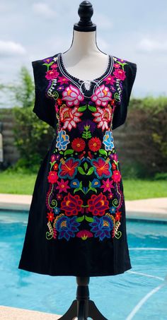 Beautiful embroidered dress made in Mexico. This is a perfect gift for a loved one or to add to your collection. * Imported from Cuernavaca, Morelos Mexico * Small tie in front * Ties on the back to adjust fit * Embroidered floral design * Decorated Collar * Sleeveless Embroidered Collars, Floral Embroidered Dress, Large Dress, Floral Kimono, Mexican Style, Kimono Dress, Dress Floral, Event Dresses, Embroidered Dress