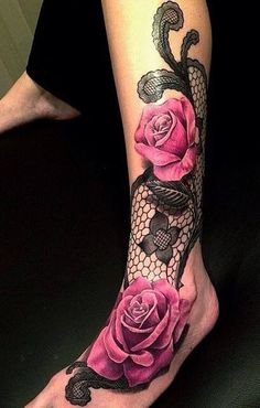 a woman's foot with pink roses and lace on the bottom part of her leg