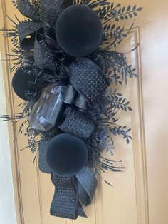 a black wreath hanging on the front door