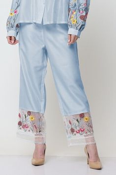 Blue shirt with placed floral thread embroidery, pleated bodice and pearl embellishments. Comes with embroidered pant. - Aza Fashions Blue Embroidered Spring Pants, Spring Cotton Sets With Embroidered Sleeves, Feminine Floral Embroidered Sets For Spring, Feminine Floral Embroidered Spring Sets, Elegant Floral Embellished Sets For Spring, Floral Embroidered Trousers For Spring, Spring Straight Pants With Floral Embroidery, Elegant Embroidered Summer Pants, Elegant Summer Pants With Floral Embroidery