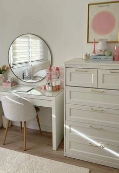 a white desk with a mirror on top of it