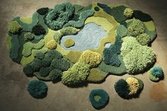 a rug made to look like a pond surrounded by trees